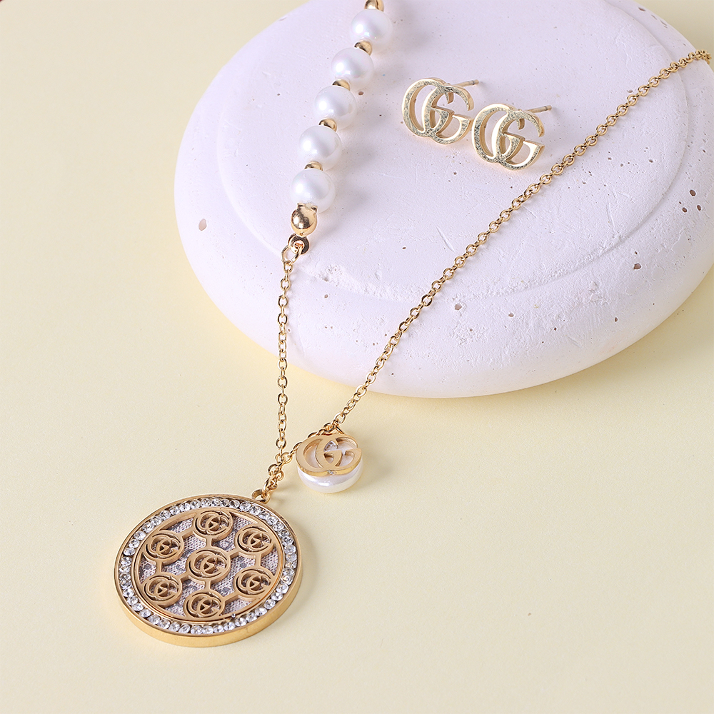 طقم ذهبي دائري GG